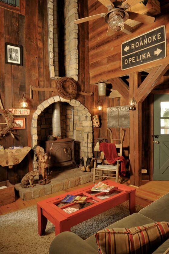 The enormous open-faced fireplace is one of Guy’s unique designs, built for function as well as form. Because the family lost everything in a fire 18 years ago, he wanted every part of this fireplace to be visible. It easily heats the entire house.